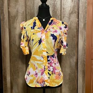 NY&Co puff sleeve blouse with modern bouquet pattern. V-neck button-front blouse